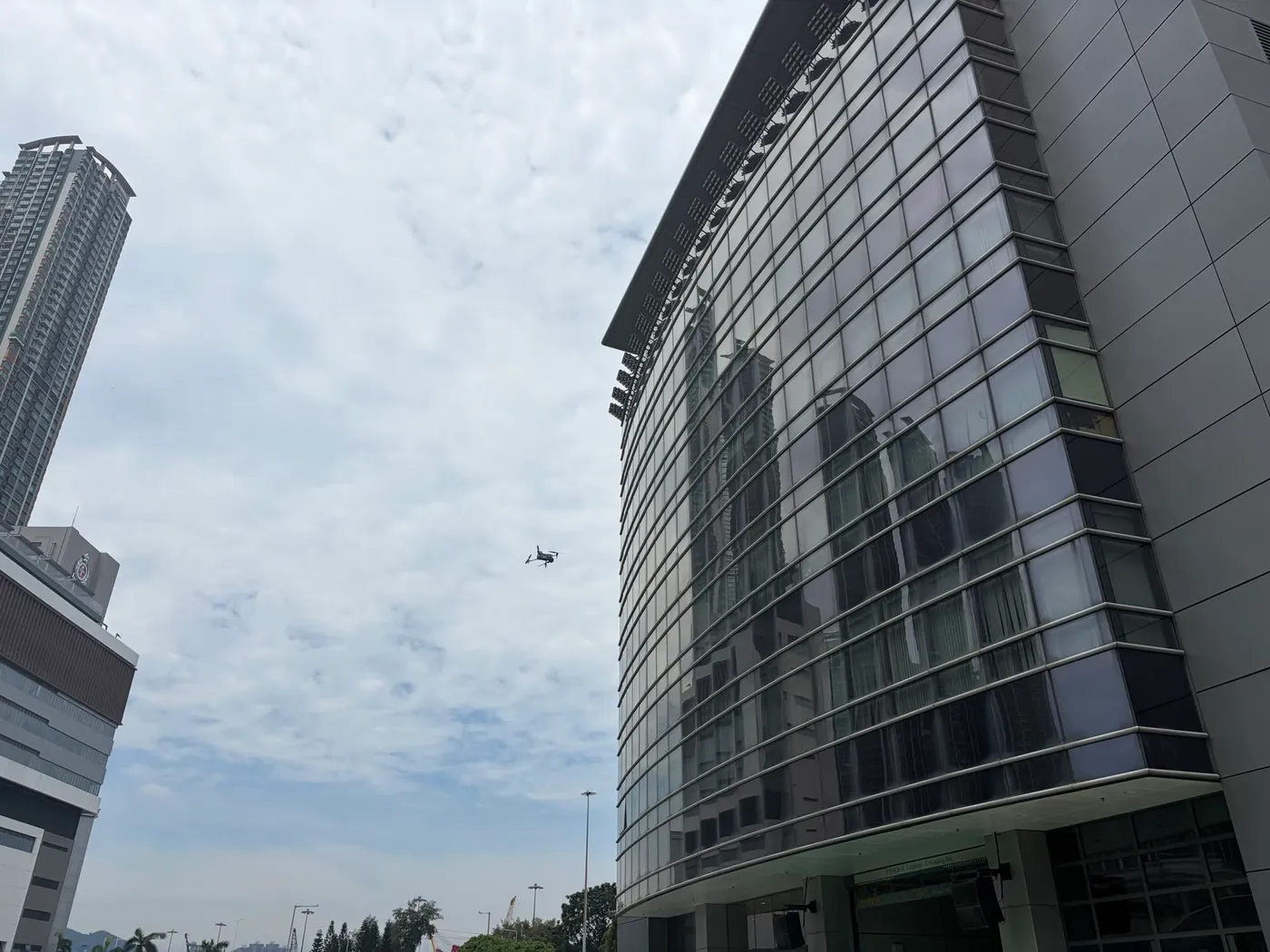 A Swift Cruise drone surveying a curtain-wall facade in Hong Kong