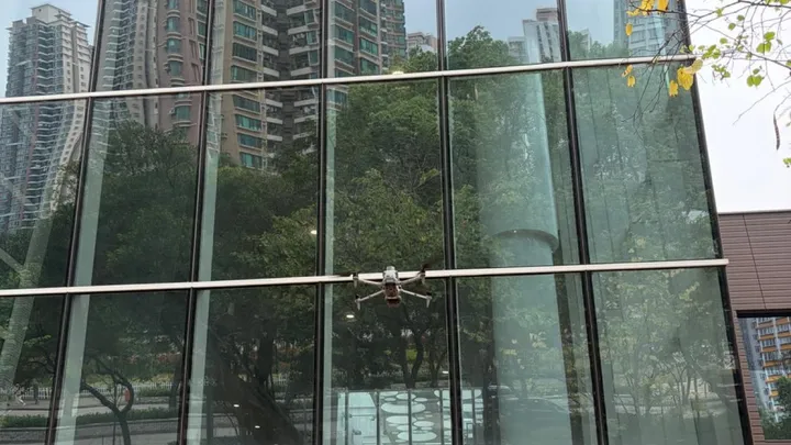 A drone capturing a building facade